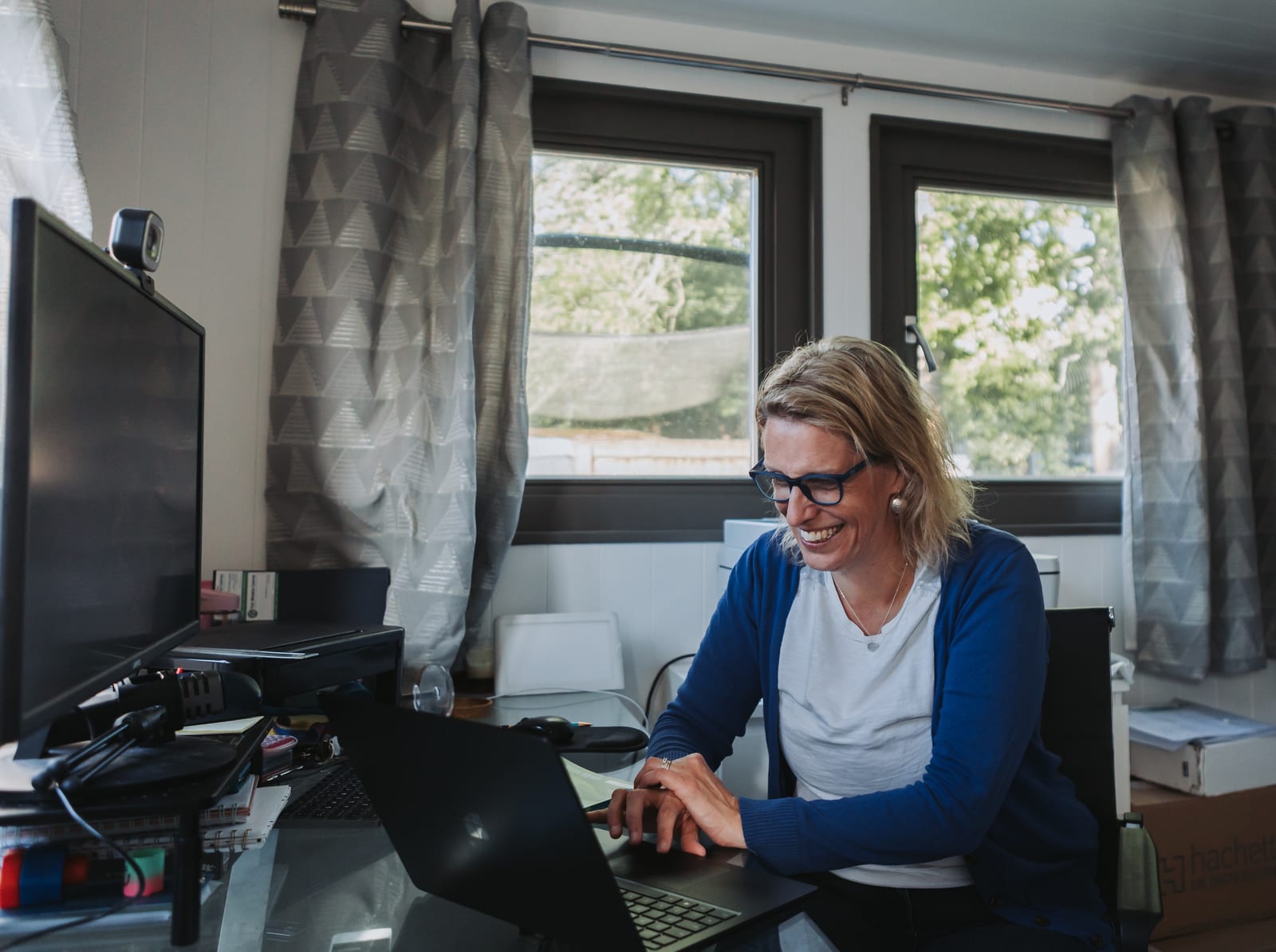 Dr Helen Ross working at her desk